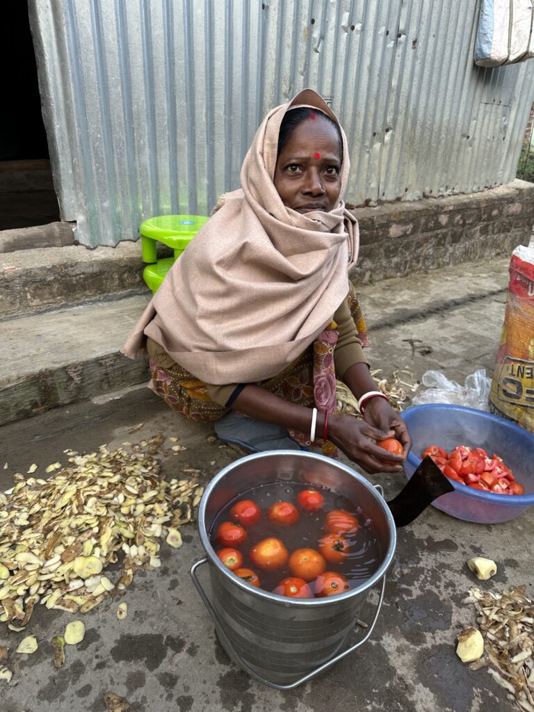 Cutting vegetables, Jamuna didi